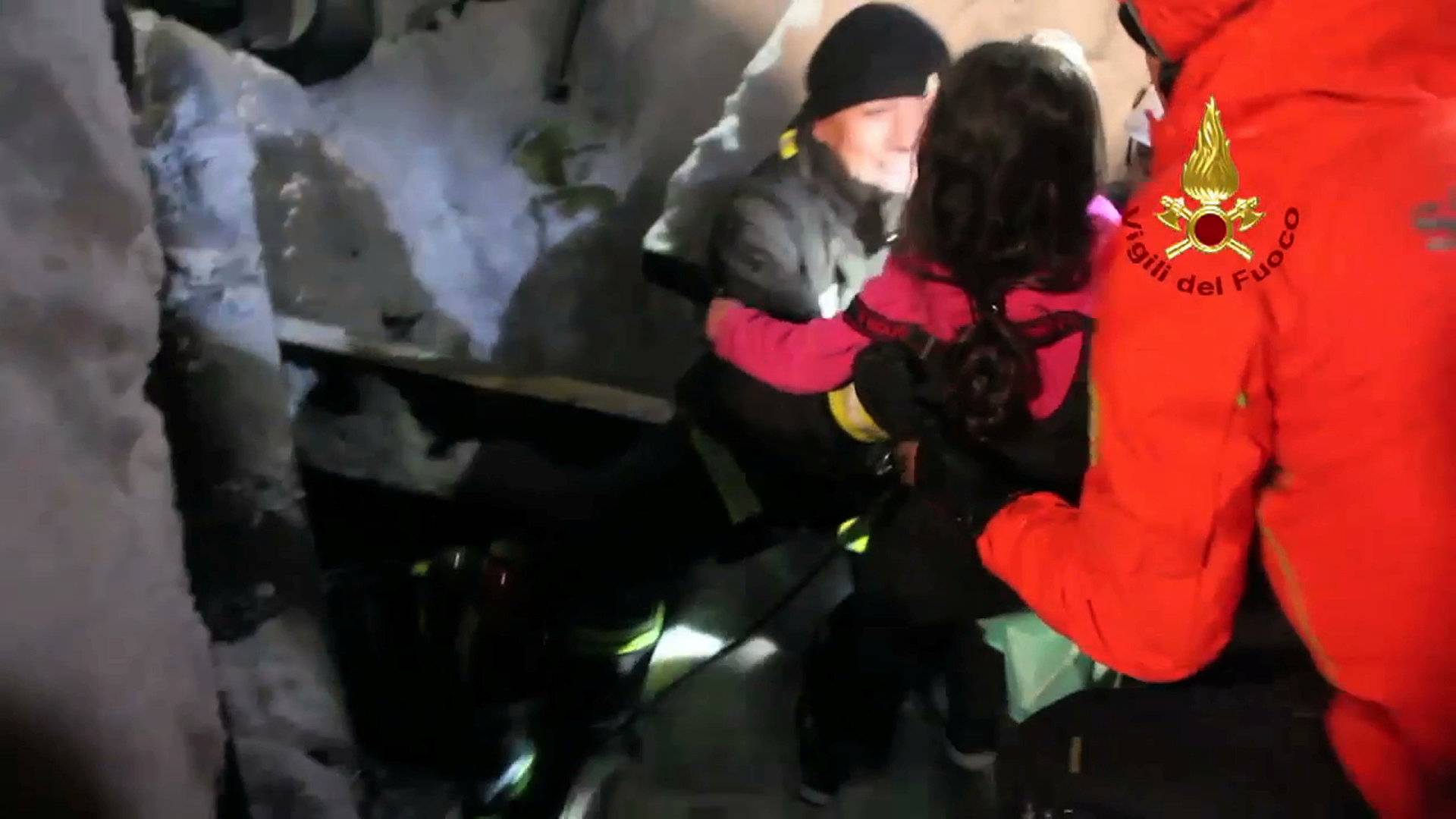 A still image taken from a video shows a survivor, rescued by Italian firefighters, at the Hotel Rigopiano in Farindola, central Italy, which was hit by an avalanche