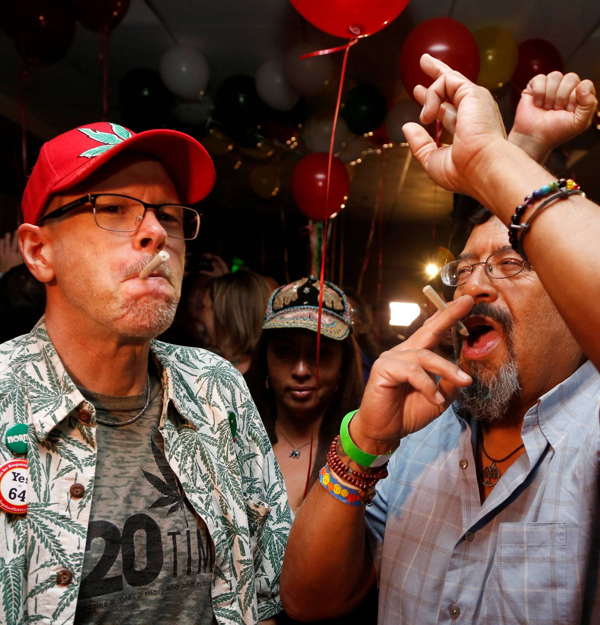 Britt and Moreno celebrate after Californians voted to pass Prop 64, legalizing recreational use of marijuana in the state, in Los Angeles, California