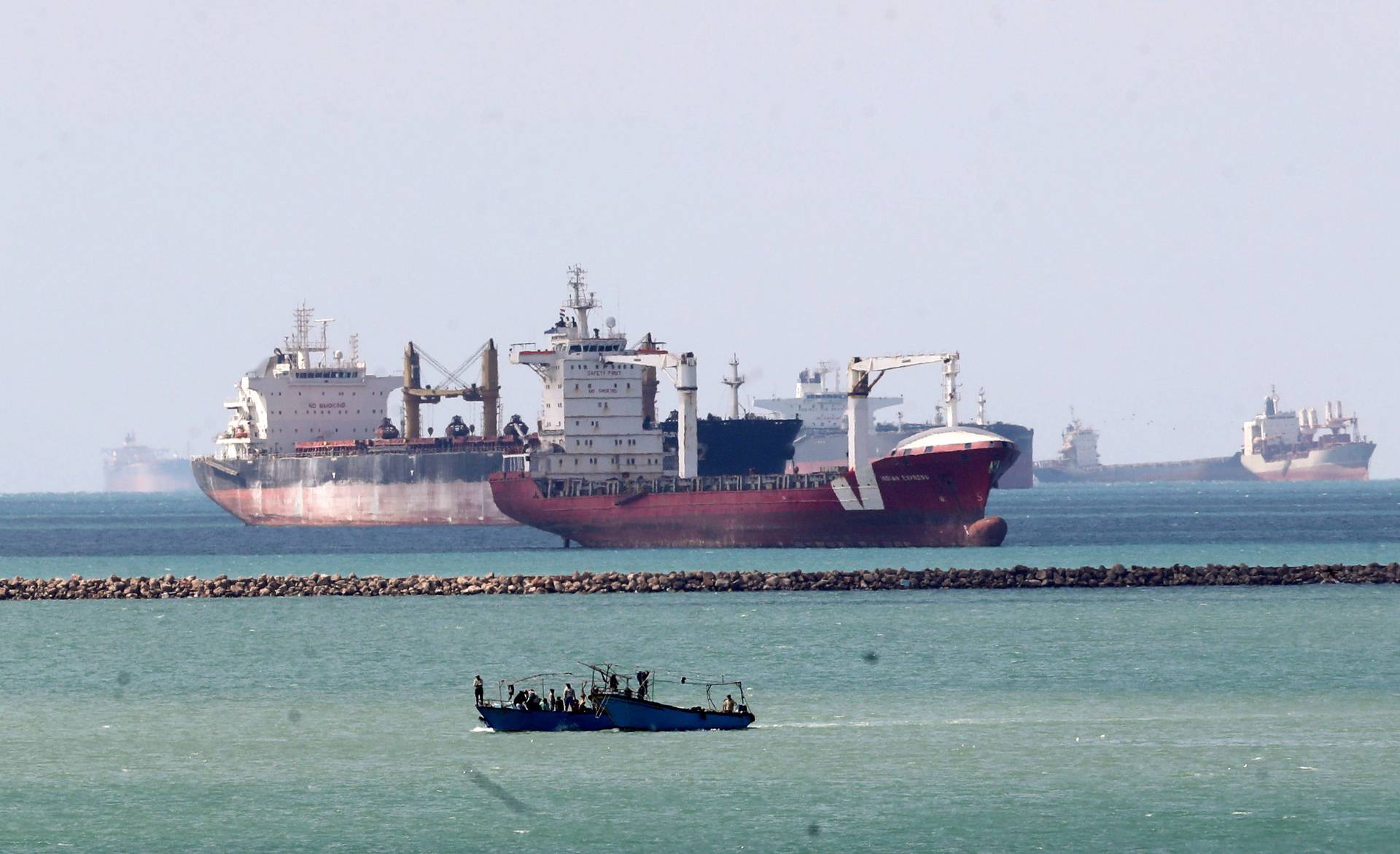 FILE PHOTO: Ships and boats are seen at the entrance of Suez Canal, which was blocked by stranded container ship Ever Given that ran aground