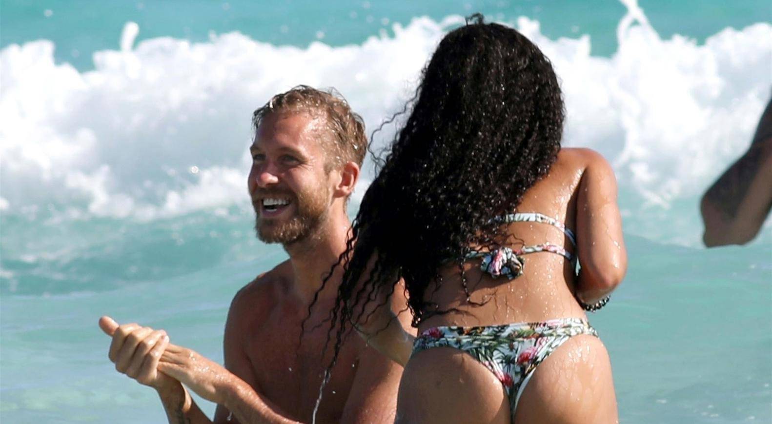 *PREMIUM-EXCLUSIVE* MUST CALL FOR PRICING BEFORE USAGE  - STRICTLY NOT AVAILABLE FOR ONLINE USAGE UNTIL 22:00 PM UK TIME ON 25/08/2022  - Scottish DJ Calvin Harris and his girlfriend Vick Hope look very much in love as they are snapped having a great t
