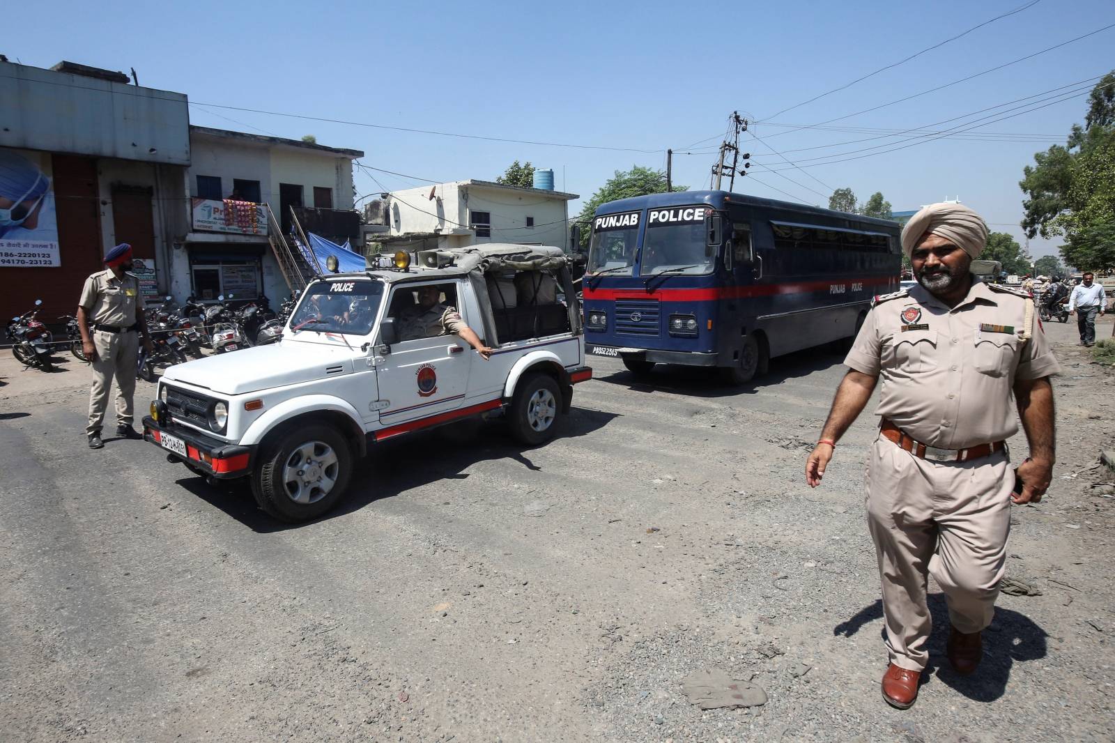 A police bus carrying the men accused of rape and murder of an eight-year-old girl in Kathua, near Jammu, arrives at a court in Pathankot