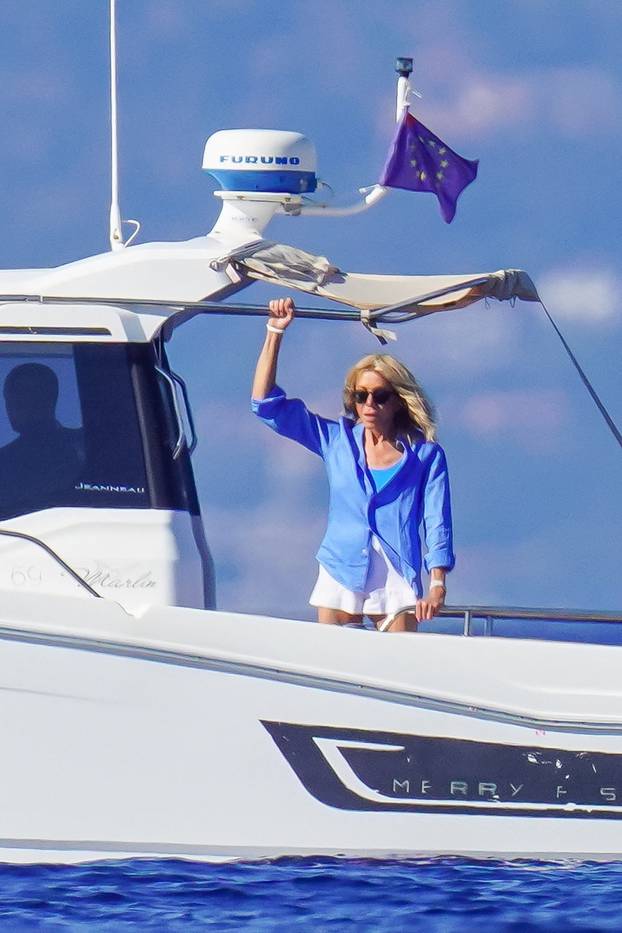 EXCLUSIVE: Emmanuel Macron and his wife Brigitte enjoy a boat day in Porquerolles island during their presidential holidays in South of France