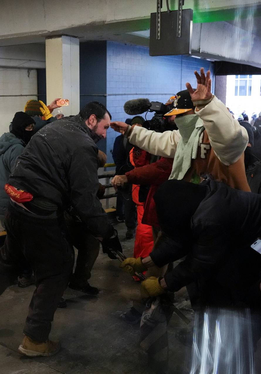 People attend the "March Against Minnesota Fraud" in Minneapolis