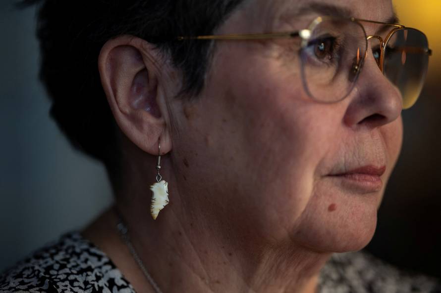Liv Aurora Jensen withe her son Inuk Stender Jensen watch news about meeting between top U.S. officials and the foreign ministers of Denmark and Greenland, in their home in Nuuk