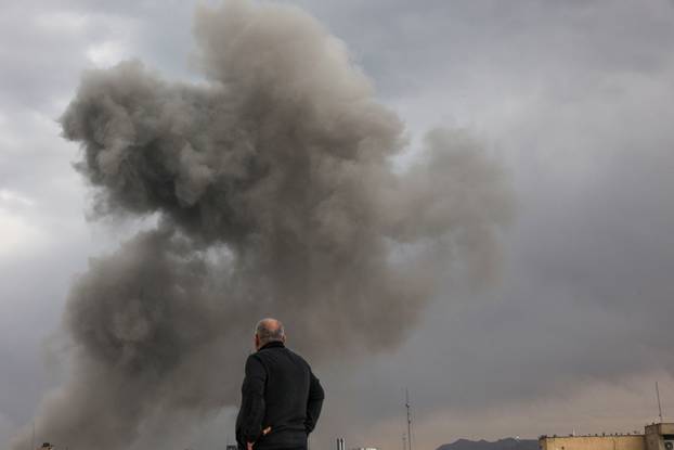 Smoke rises following an explosion, after Israel and the U.S. launched strikes on Iran, in Tehran