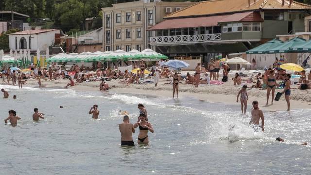 People rest at a Black Sea beach in Odesa