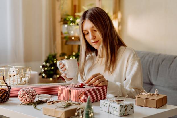 Woman,Wrapping,Christmas,Eco,Natural,Gift,Boxes,At,Home.,Preparing