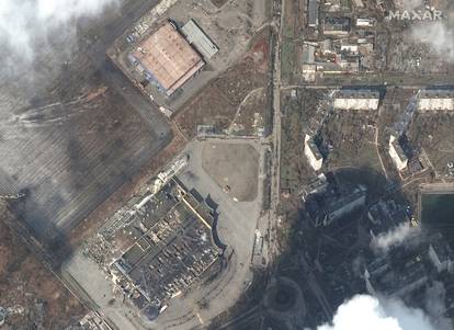 A satellite image shows heavily damaged shopping mall and other stores in Mariupol