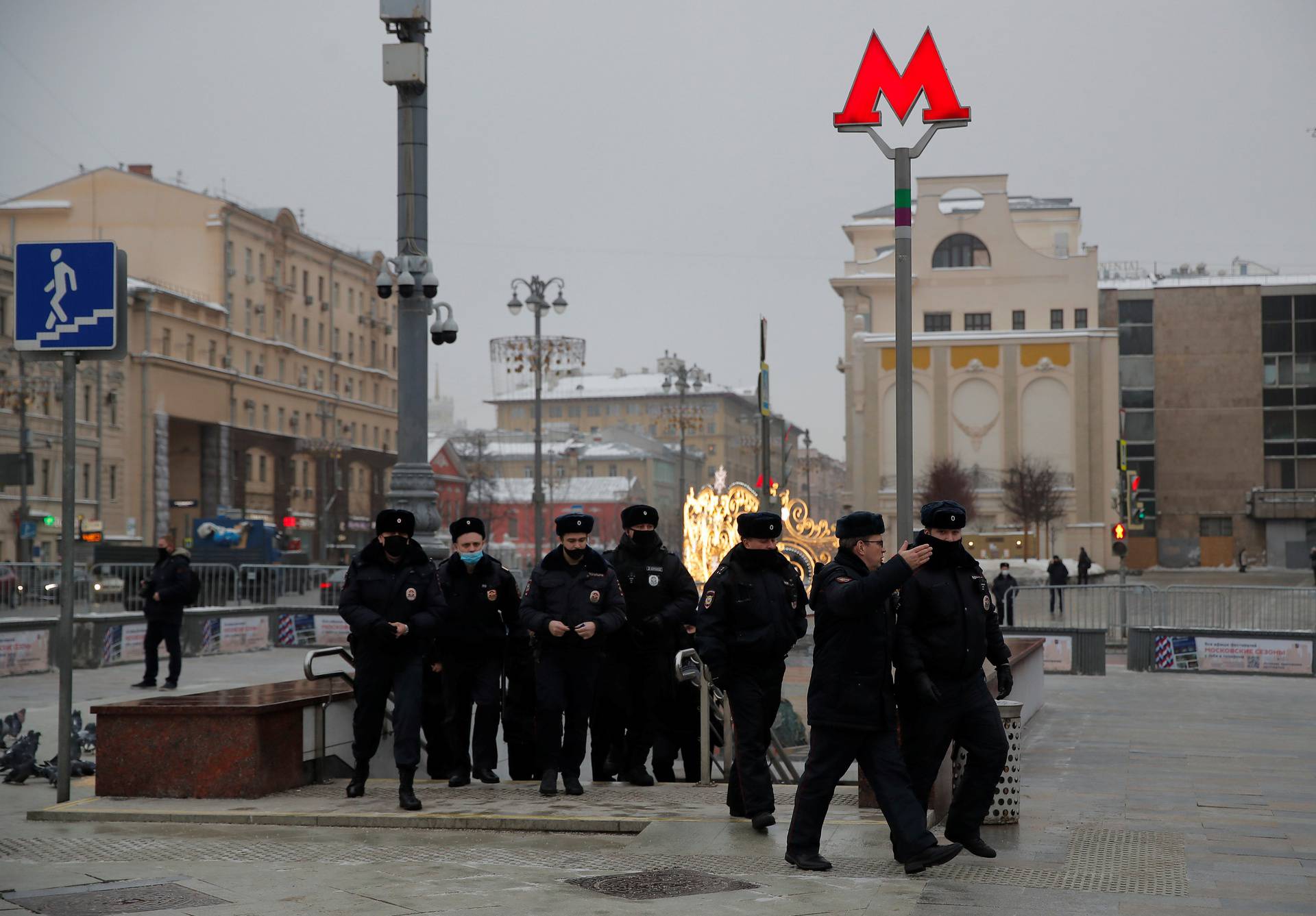 Police officers walk out of the underpass as supporters of opposition leader Navalny are expected to protest in Moscow