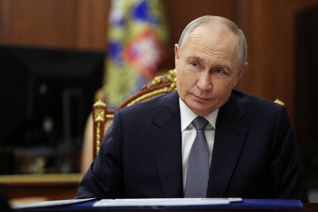 Russian President Vladimir Putin meets with Culture Minister Olga Lyubimova in Moscow