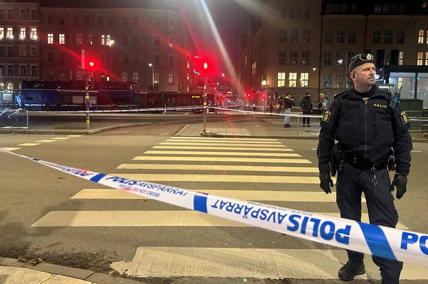 Swedish police stands near the site where a bus crashed in Stockholm
