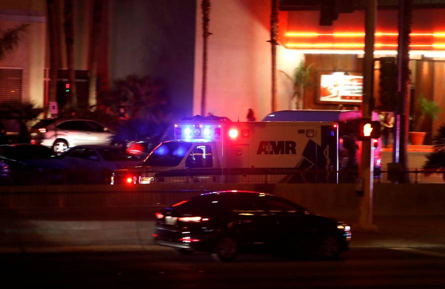 An ambulance heads to a hospital after a mass shooting at a music festival on the Las Vegas Strip in Las Vegas