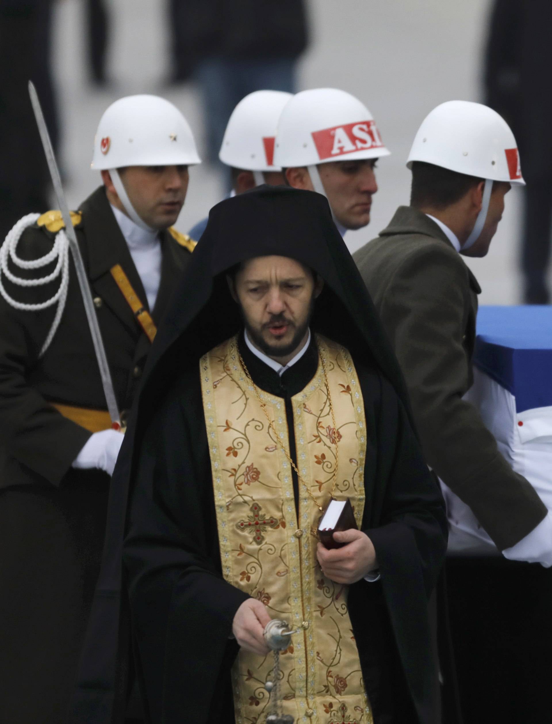 Flag-wrapped coffin of late Russian Ambassador to Turkey Karlov is carried to a plane during a ceremony at Esenboga airport in Ankara