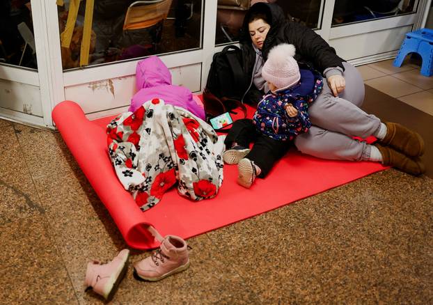 People take shelter during a Russian missile and drone attack, in Kyiv