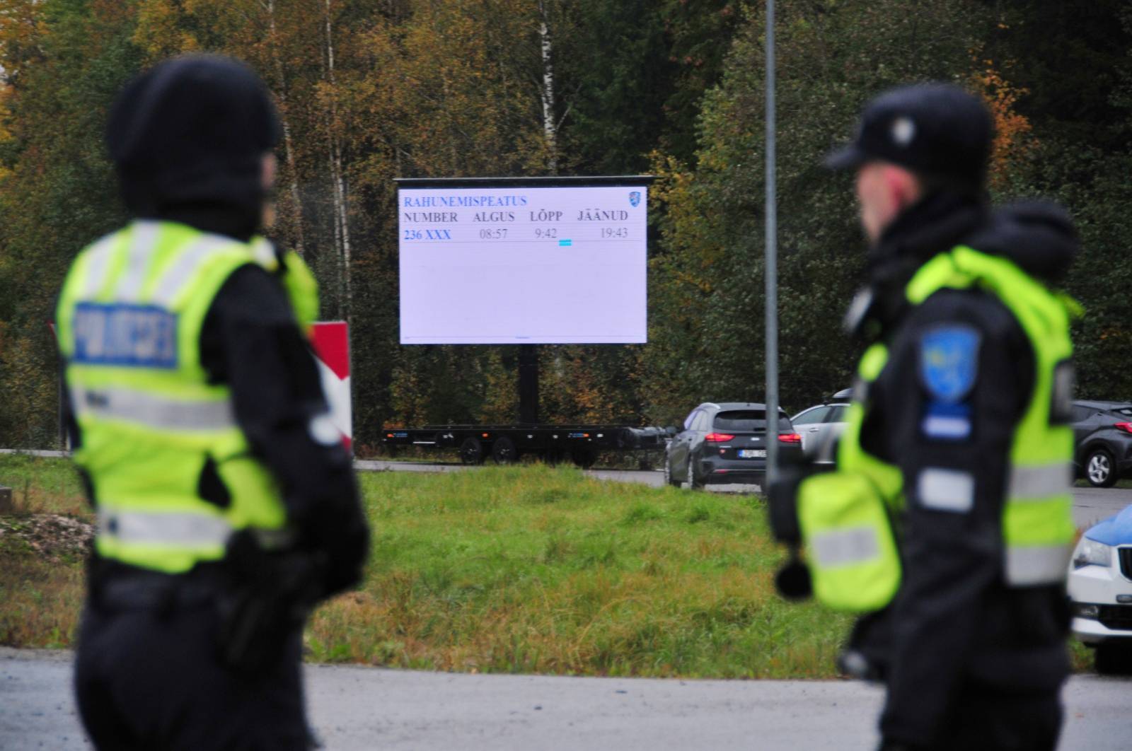 Estonian police officers look on near Rapla