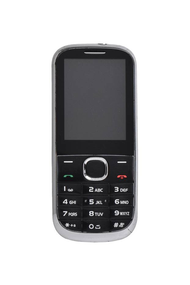 Old Mobile Phone isolated on white background. Classic mobile cell phone