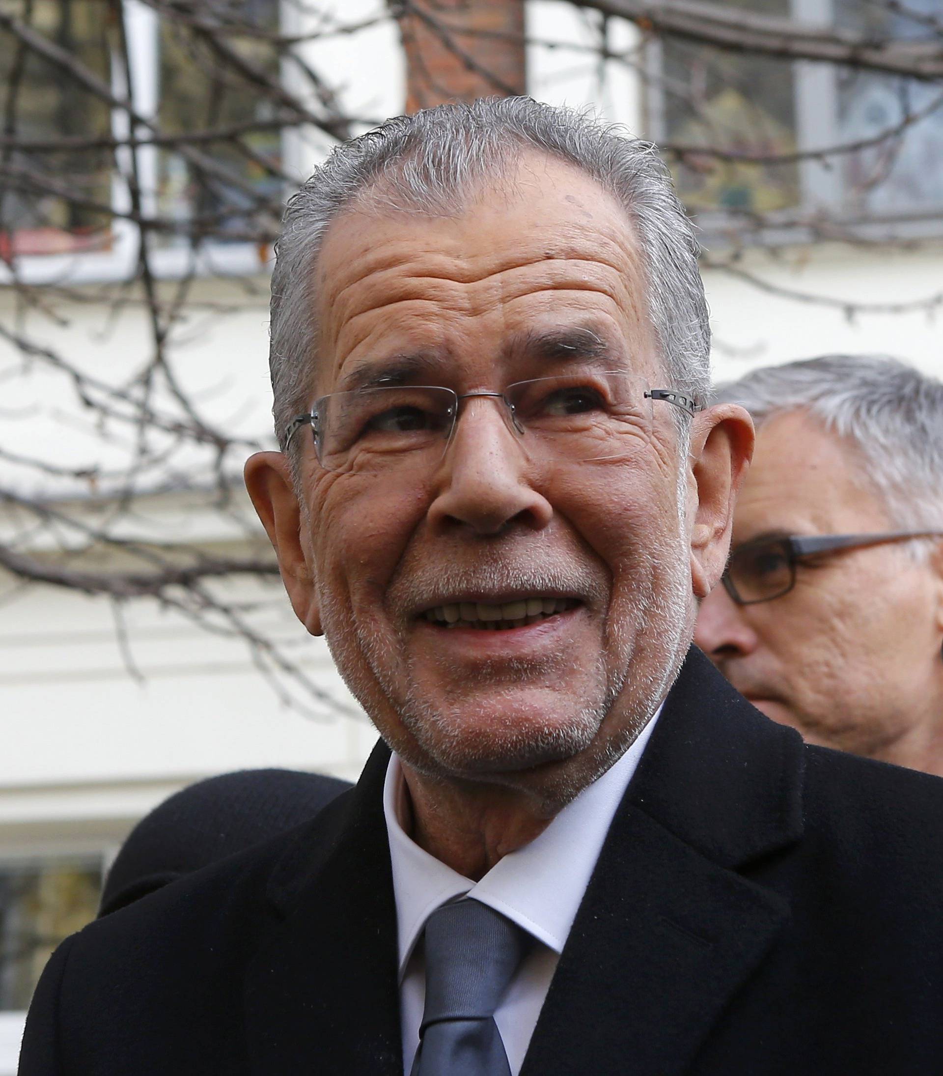 Austrian presidential candidate Van der Bellen, who is supported by the Greens, leaves a polling station in Vienna