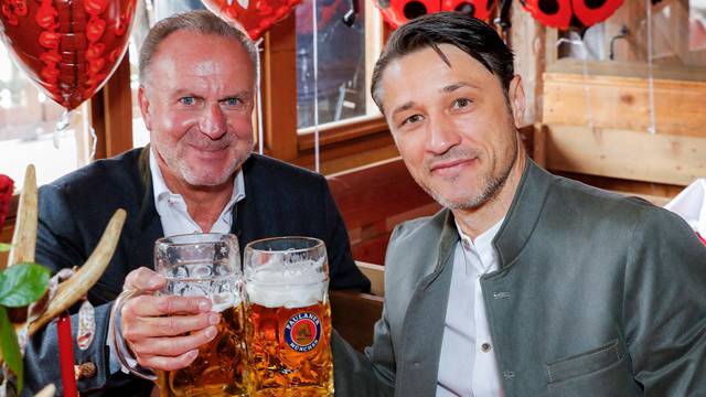 FC Bayern Munich's coach Niko Kovac and CEO Karl-Heinz Rummenigge pose during a visit at the Oktoberfest in Munich