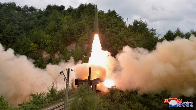 FILE PHOTO: A missile is seen launched during a drill of the Railway Mobile Missile Regiment in North Korea