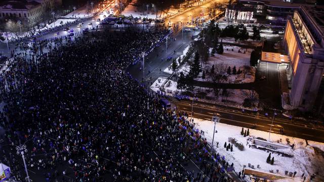 People take part in a demonstration to protest against government plans to reform some criminal laws through emergency decree, in Bucharest