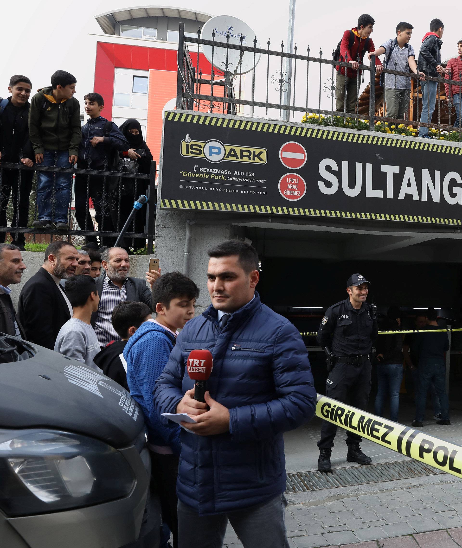Turkish police officers stand guard at the entrance of a car park where a vehicle belonging to Saudi Arabia's consulate was found, in Istanbul
