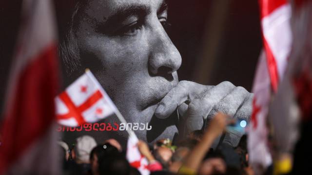 FILE PHOTO: Supporters of Georgian ex-president Mikheil Saakashvili hold a rally in Tbilisi