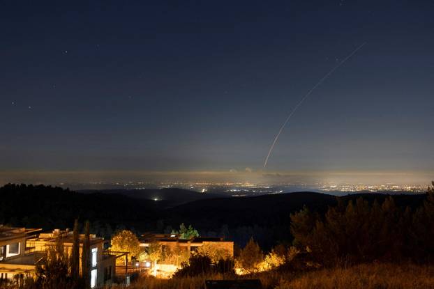 Missiles launched from Iran towards Israel are intercepted, as seen from Neve Ilan