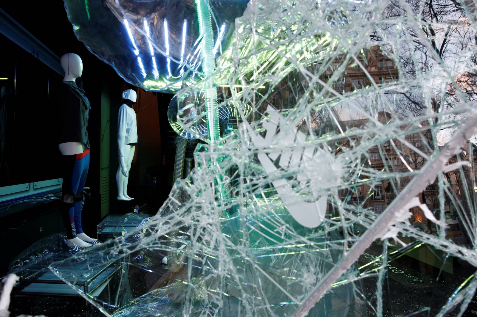 The damaged window of a Nike store is pictured on the Champs-Elysees after a demonstration by the "yellow vests" movement in Paris