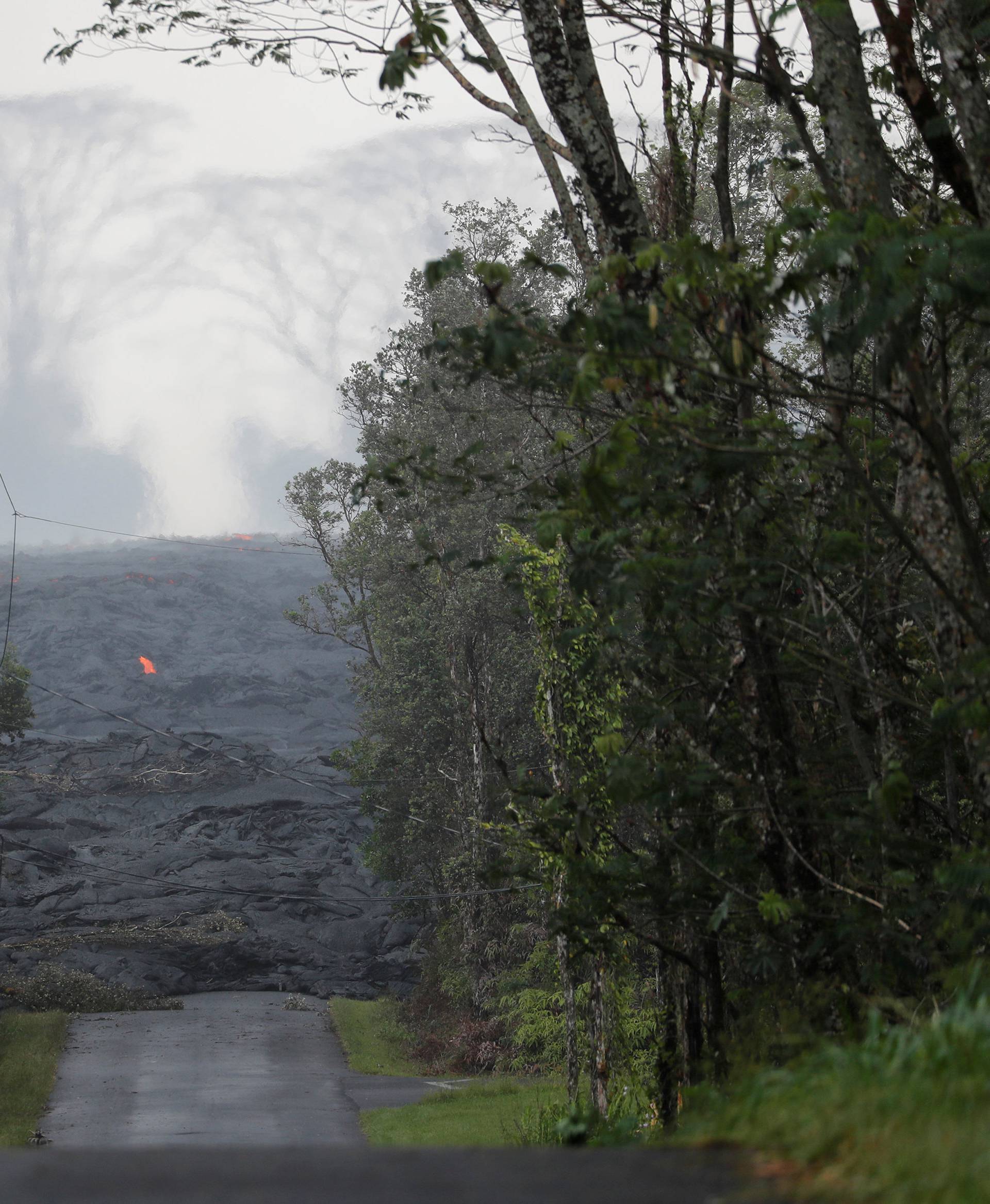 The Kilauea lava flow cuts off Kahukai Street, in the Leilani Estates near Pahoa, Hawaii