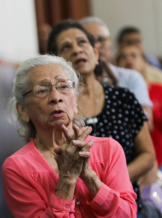 People attend Mass during a national day of prayer, following earthquakes in Valencia