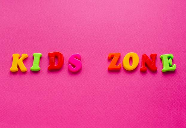 words "kids zone" on pink background