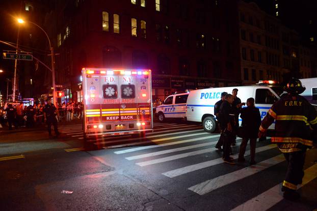 New York City police and firefighters stand near site of explosion in New York