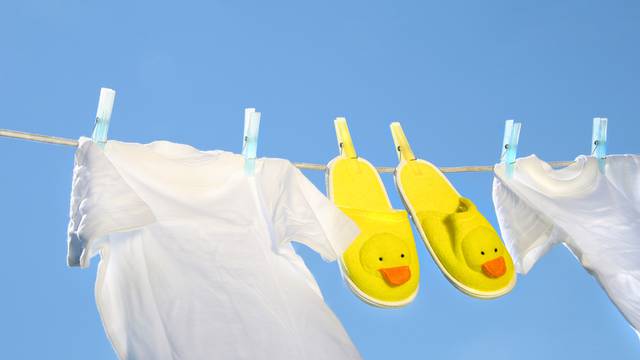 White t-shirts and slippers on the clothesline