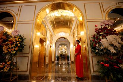 An employee in traditional dress is seen in the newly-inaugurated Dolce Hanoi Golden Lake luxury hotel, after the government eased a nationwide lockdown following the global outbreak of the coronavirus disease (COVID-19), in Hanoi