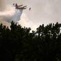 FILE PHOTO: A Canadair firefighting aircraft drops water to battle a wildfire in the Var region of France