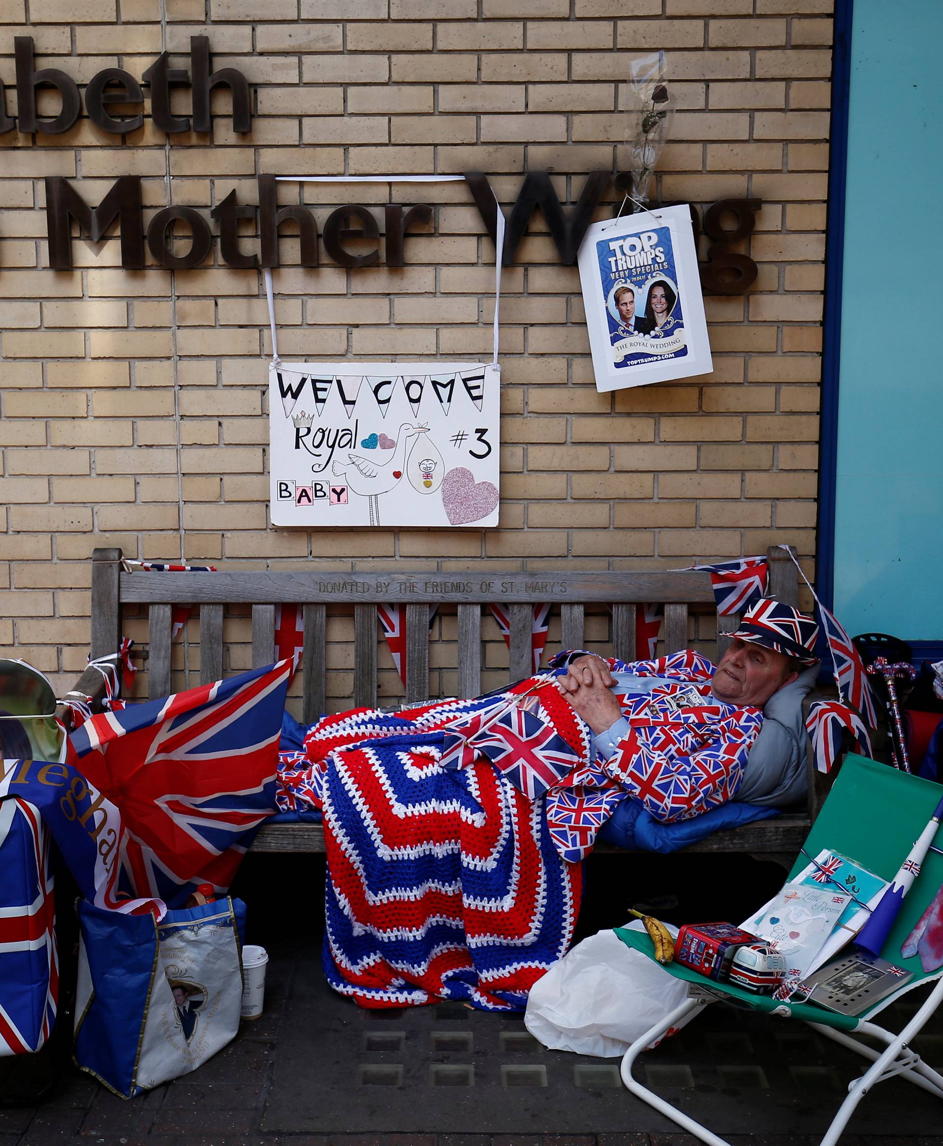 A fan of Britain's royal family camps outside the hospital where Catherine, Duchess of Cambridge is due to give birth, in London