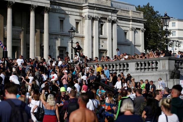 People gather in Trafalgar Square to protest against the lockdown imposed by the government, in London