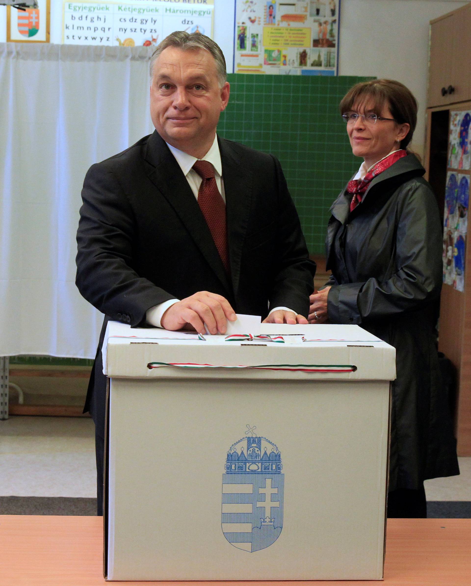Hungary's Prime Minister Orban casts his ballot next to his wife Levai inside a polling station during a referendum on EU migrant quotas in Budapest
