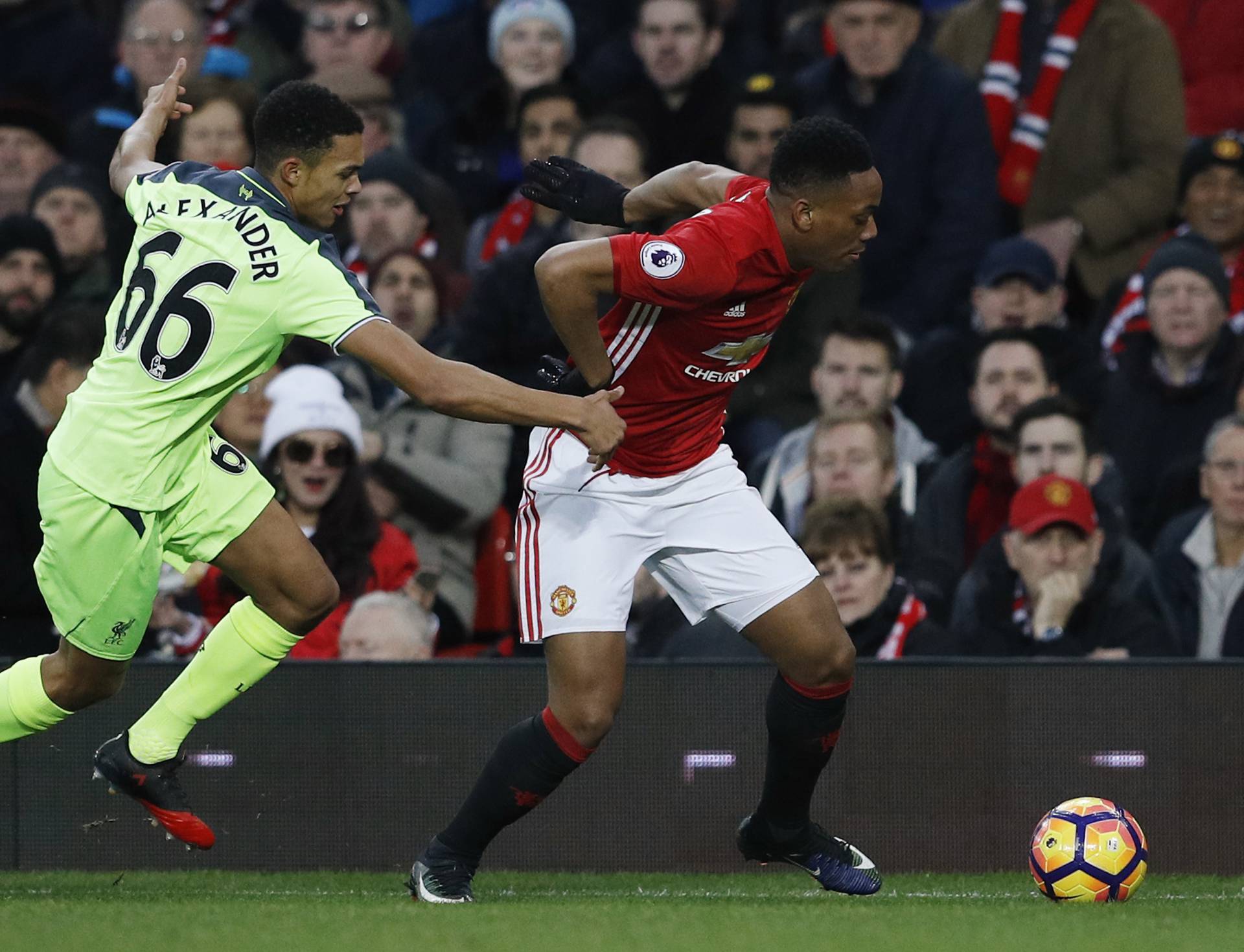 Manchester United's Anthony Martial in action with Liverpool's Trent Alexander-Arnold