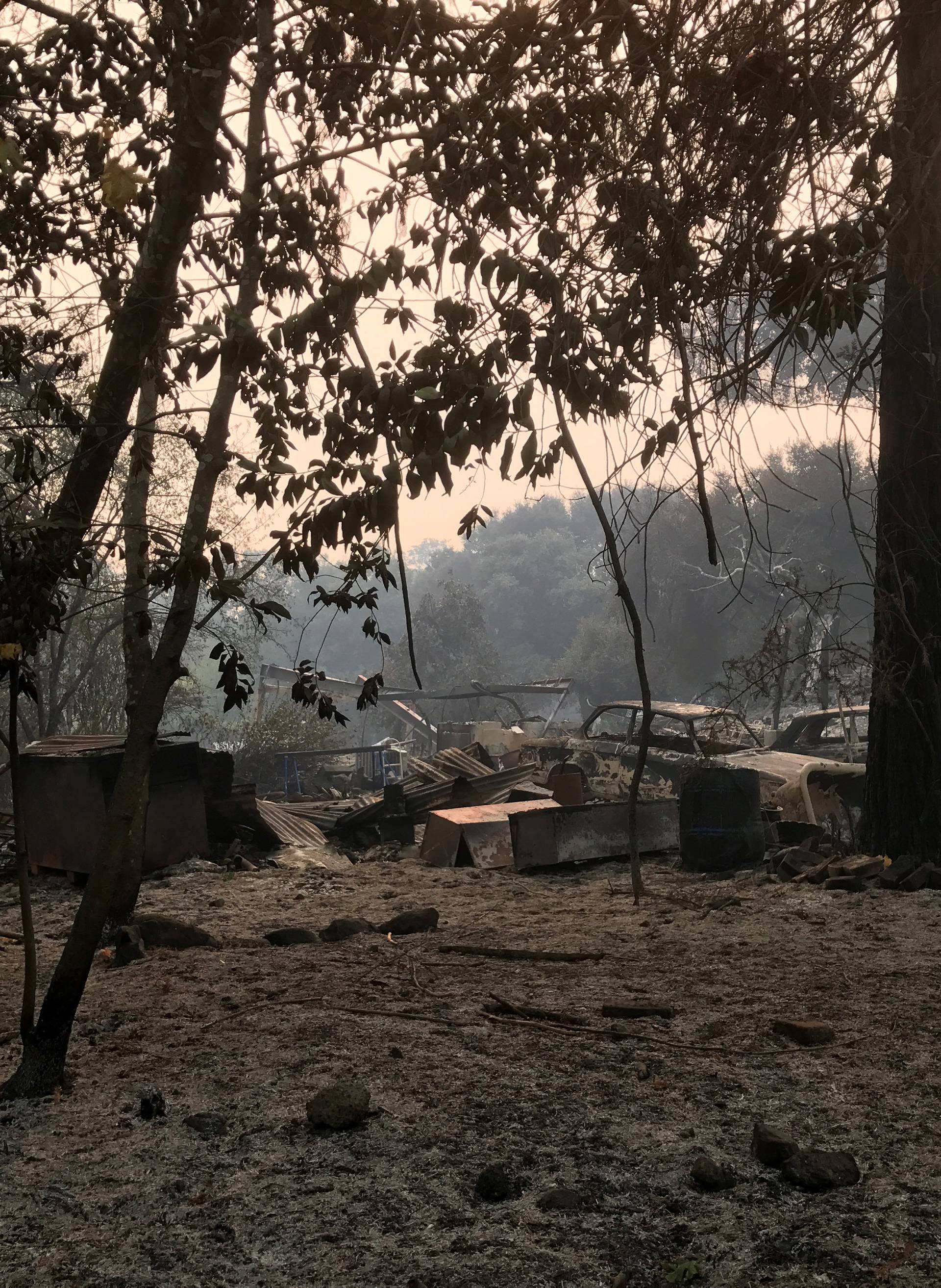 A destroyed home lays in ruins as firefighters have been battling to halt the advance of wildfires from 22 difference blazes across nine counties, in Glen Ellen, California
