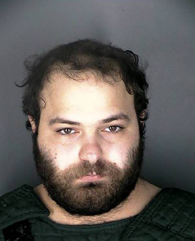 Ahmad Al Aliwi Alissa poses for a county jail booking photograph in Boulder