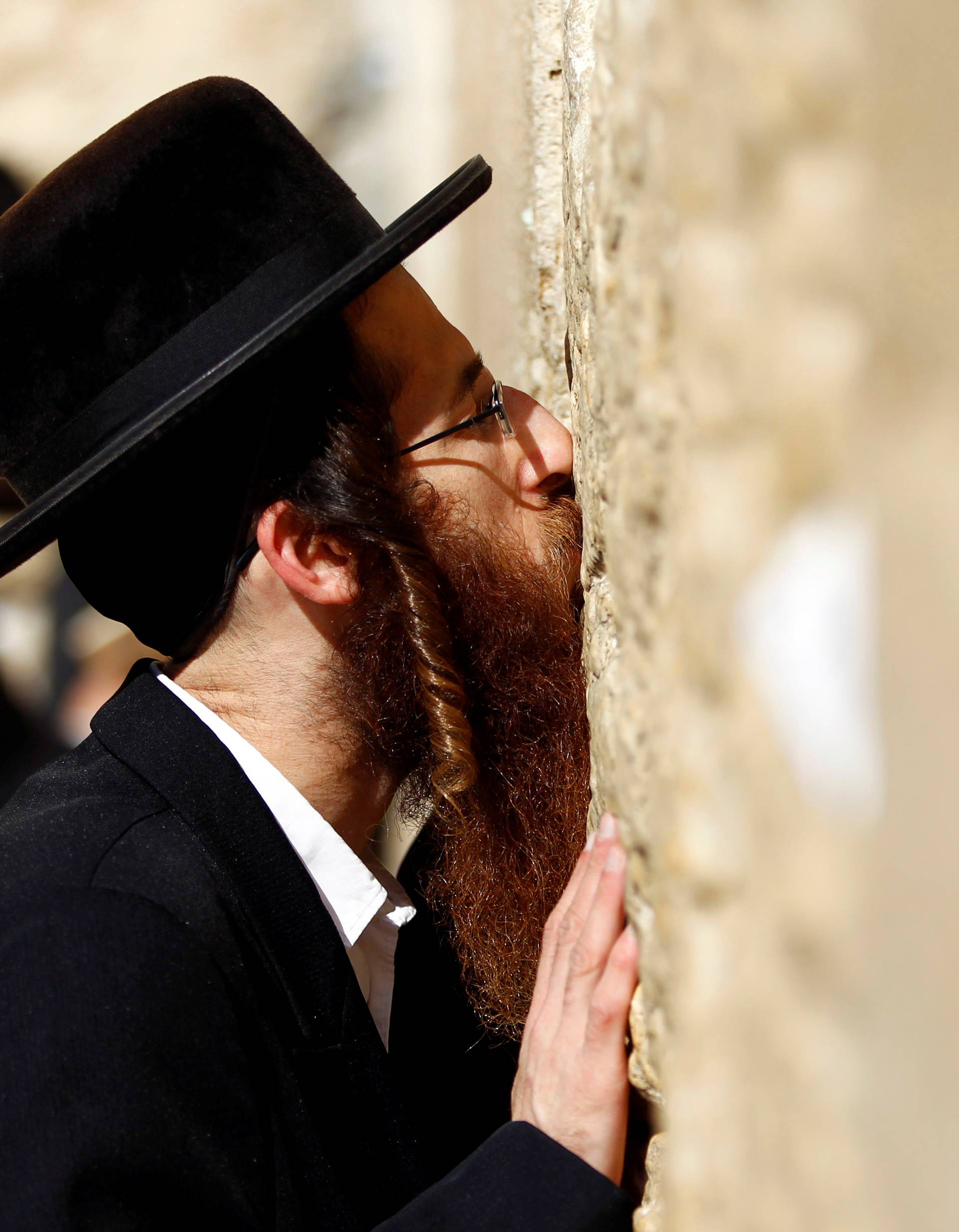 FILE PHOTO: An ultra-Orthodox Jewish man kisses the Western Wall in Jerusalem's Old City