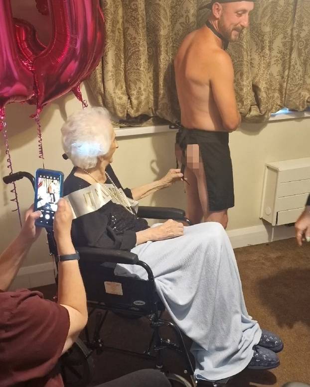 Tea and beef-cake! OAP gets Butler in the Buff for her 103rd birthday at care home