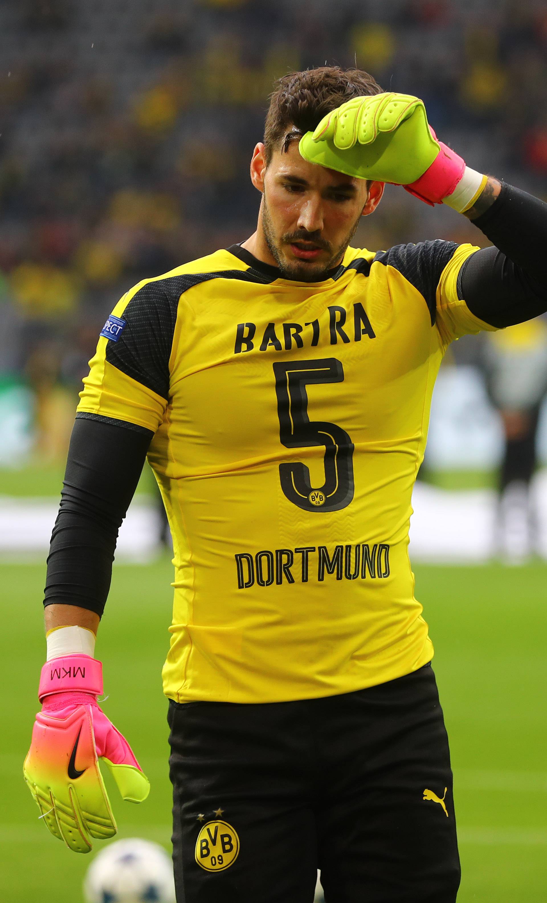 Borussia Dortmund's Roman Burki wears the shirt of Marc Bartra before the match