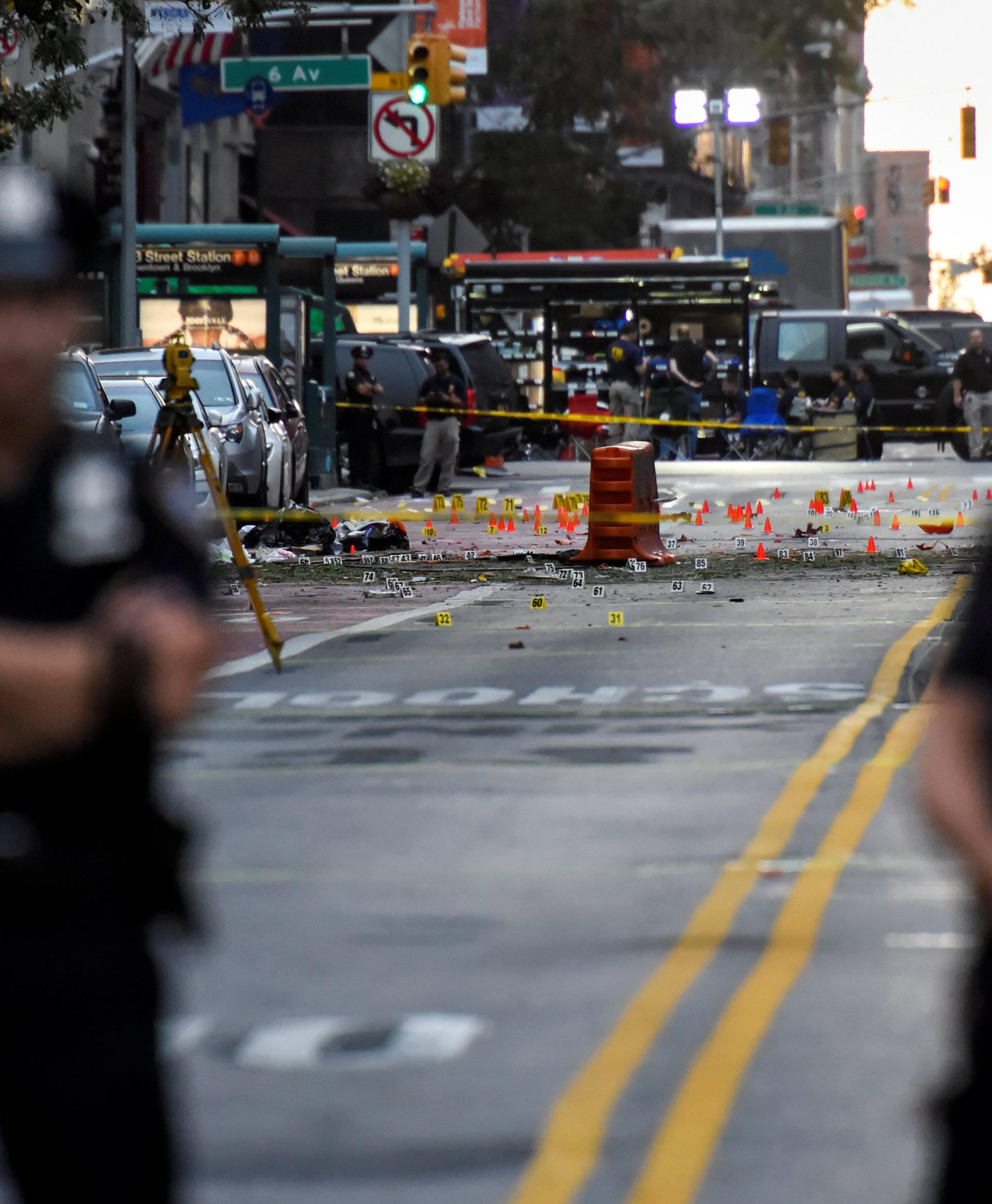 NYPD officers stand near the site of an explosion in New York
