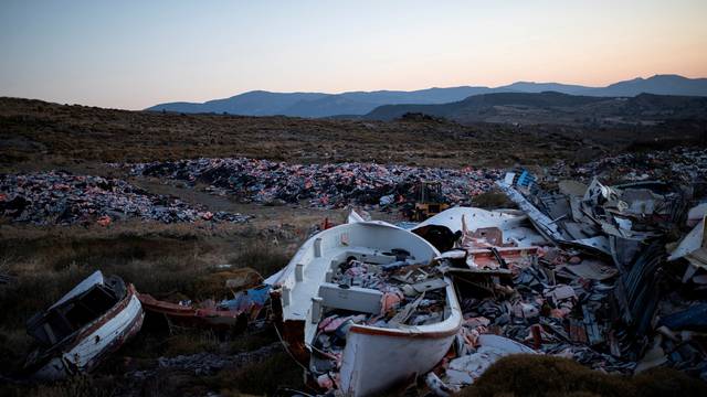 FILE PHOTO: Lifejackets are seen inside a wrecked boat used by refugees and migrants to cross part of the Aegean Sea from Turkey to Greece, at a garbage dump site of thousands of lifejackets, near the town of Mithymna (also known as Molyvos) on the island