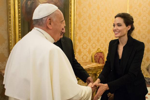 January 8, 2015: Pope Francis greets Angelina Jolie, at the Vatican.