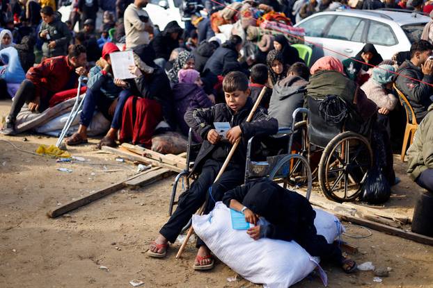 Displaced Palestinians wait to be allowed to return to their homes in northern Gaza, in the central Gaza Strip