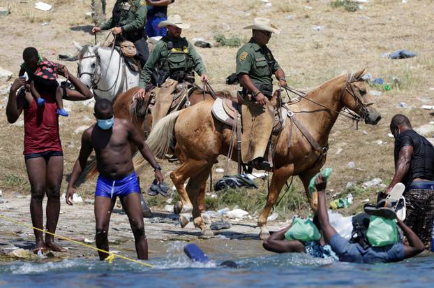 Migrants seeking refuge into the U.S. cross Rio Grande river, in Ciudad Acuna