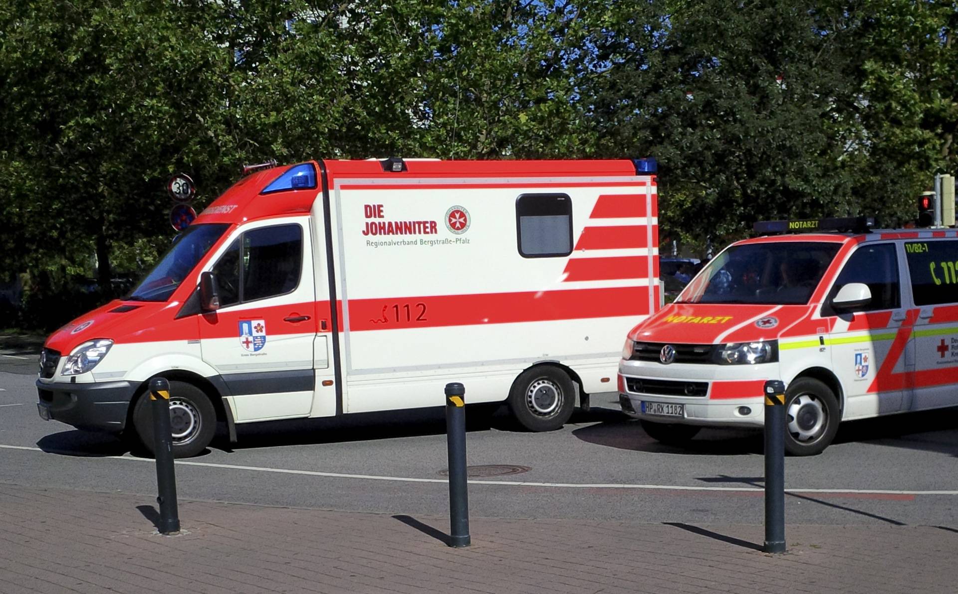 Ambulance cars are waiting after a masked man with a gun and ammunition belt opened fire in a cinema complex in Viernheim